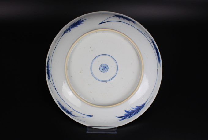 A Chinese powder-blue-ground blue and white ‘Budai’ dish, Kangxi period by Artiste Inconnu