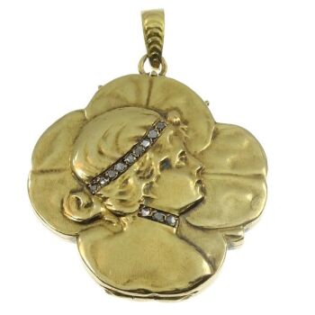 Typical Art Nouveau gold locket woman head on four leaf clover by Artista Sconosciuto