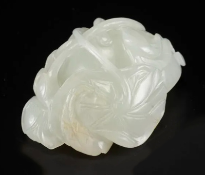 A white jade ‘Lotus Seedpod and Bug’ carving, Qing dynasty, 18th century by Artiste Inconnu