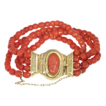 Antique four string coral bracelet with coral cameo in 18K gold closure by Artista Sconosciuto