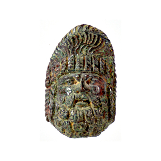 A Roman bronze applique in the shape of a theatre mask by Artista Sconosciuto