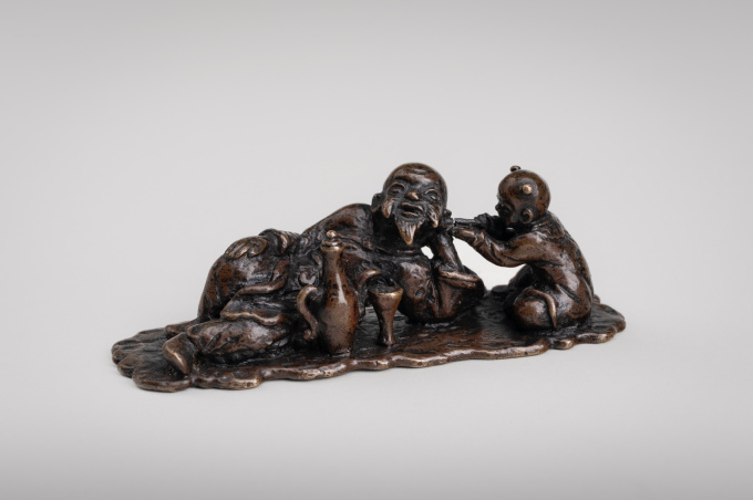 A Chinese bronze brush rest or paperweight, late Ming dynasty to early Qing dynasty, 17th century by Artista Desconhecido