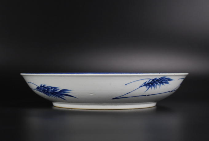 A Chinese powder-blue-ground blue and white ‘Budai’ dish, Kangxi period by Artiste Inconnu