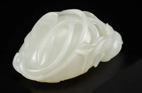 A white jade ‘Lotus Seedpod and Bug’ carving, Qing dynasty, 18th century by Artiste Inconnu