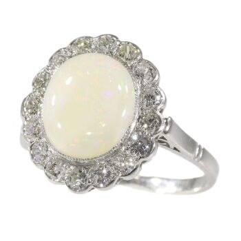 Vintage diamond and opal platinum engagement ring by Artista Sconosciuto