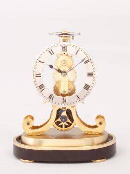A rare miniature English Victorian brass skeleton clock, Fenton, Bury, circa 1850. by Fenton Bury