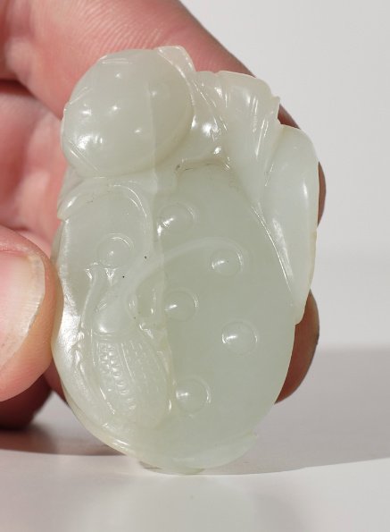 A white jade ‘Lotus Seedpod and Bug’ carving, Qing dynasty, 18th century by Artiste Inconnu