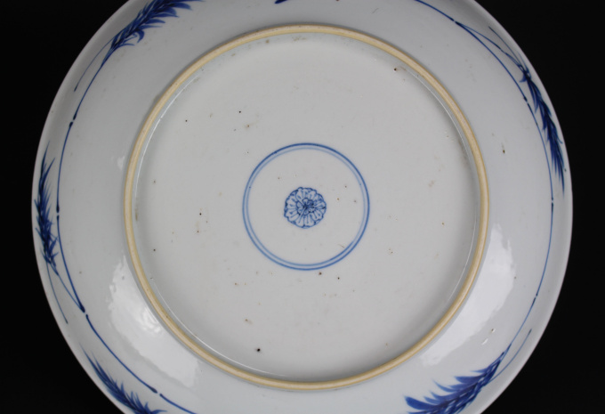 A Chinese powder-blue-ground blue and white ‘Budai’ dish, Kangxi period by Artiste Inconnu
