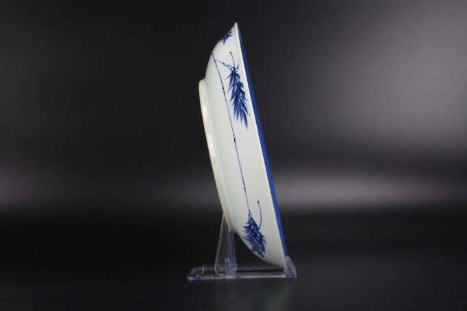 A Chinese powder-blue-ground blue and white ‘Budai’ dish, Kangxi period by Artiste Inconnu