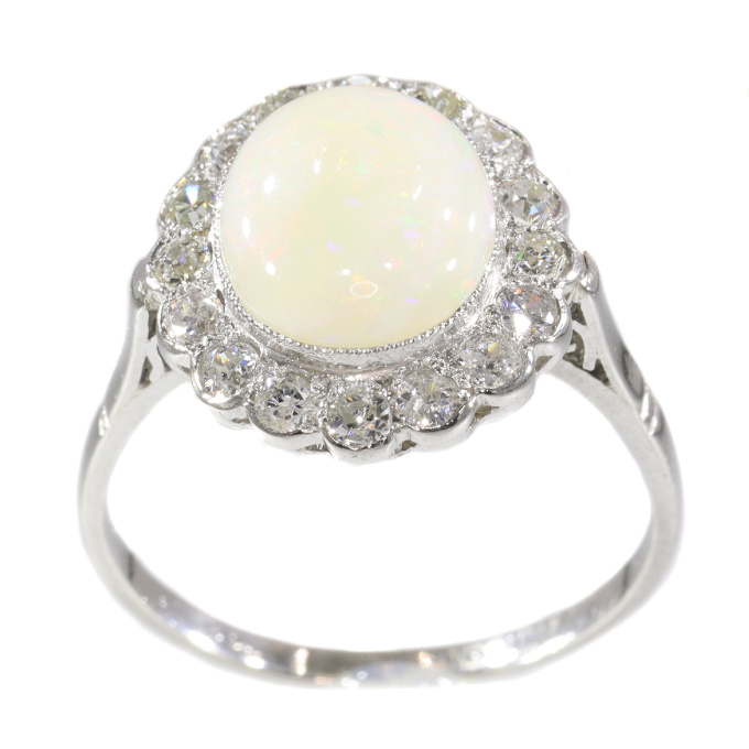 Vintage diamond and opal platinum engagement ring by Artista Desconhecido