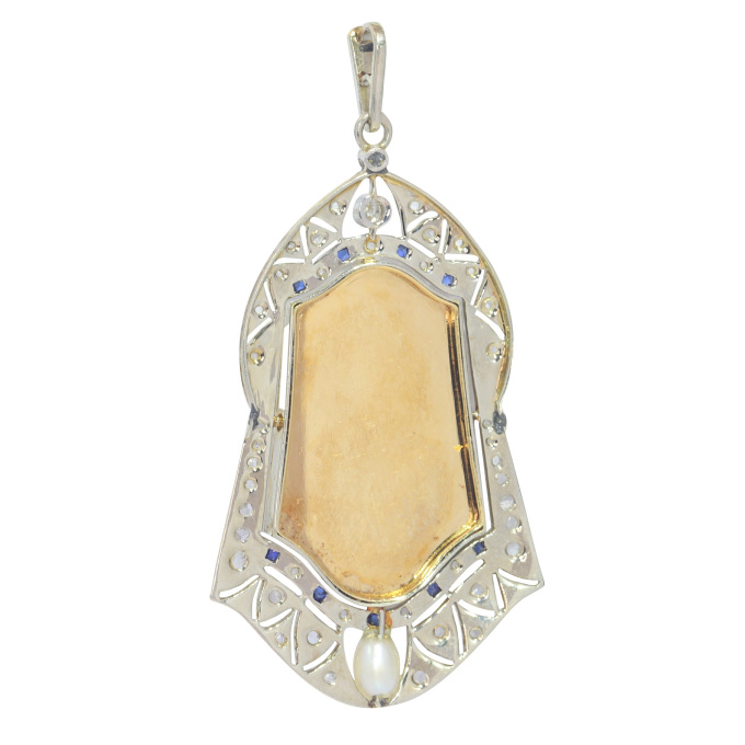 Vintage 1910's medal 18K gold pendant set with diamonds sapphires and pearl St. Anthony of Padua depicted holding the Child Jesus by Artista Sconosciuto