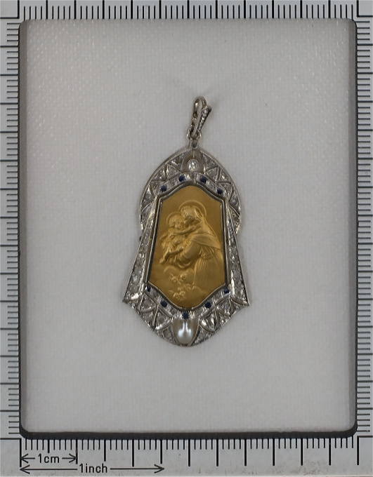 Vintage 1910's medal 18K gold pendant set with diamonds sapphires and pearl St. Anthony of Padua depicted holding the Child Jesus by Artista Sconosciuto
